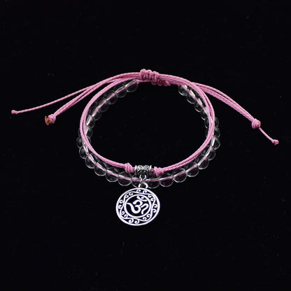 Bracelet de perle et corde symbole Hindou "Om", rose