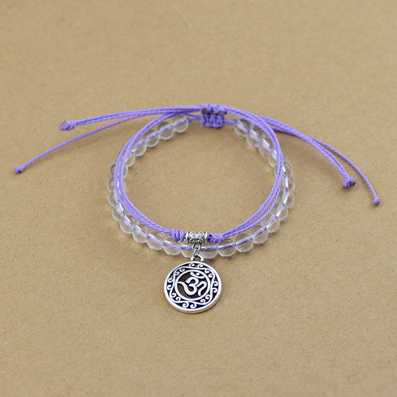 Bracelet de perle et corde symbole Hindou "Om", mauve